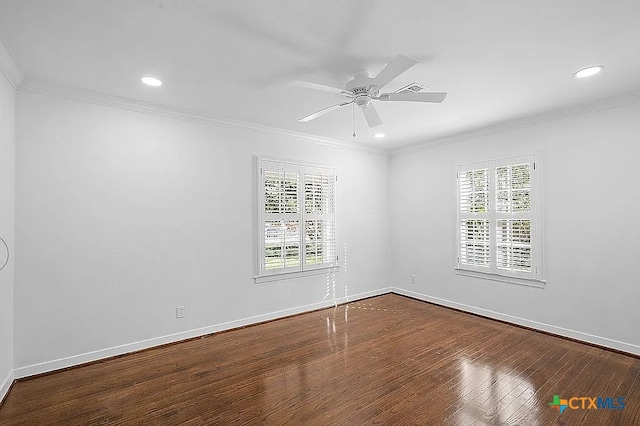 unfurnished room with a wealth of natural light, baseboards, wood finished floors, and ornamental molding