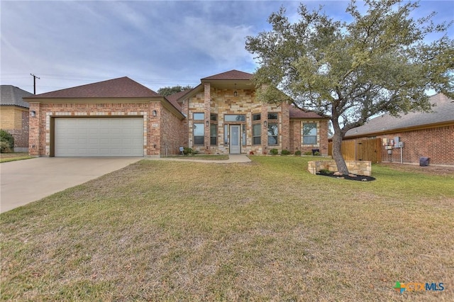 view of front of house featuring a front yard and a garage