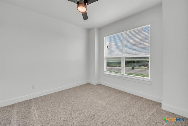 carpeted empty room with ceiling fan