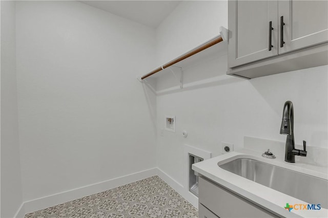 clothes washing area with cabinets, hookup for a washing machine, electric dryer hookup, and sink