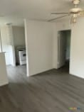 unfurnished room with dark hardwood / wood-style floors