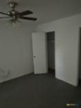 unfurnished bedroom featuring a closet and ceiling fan