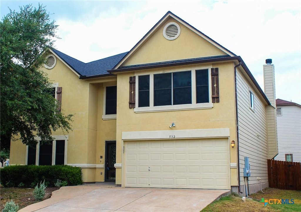 view of front of property featuring a garage