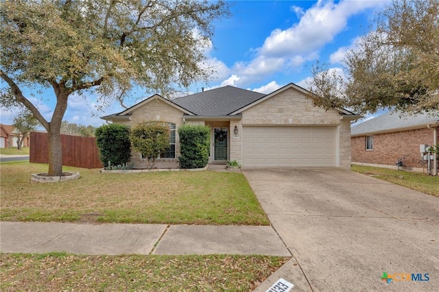 ranch-style house with a front lawn, stone siding, fence, concrete driveway, and a garage