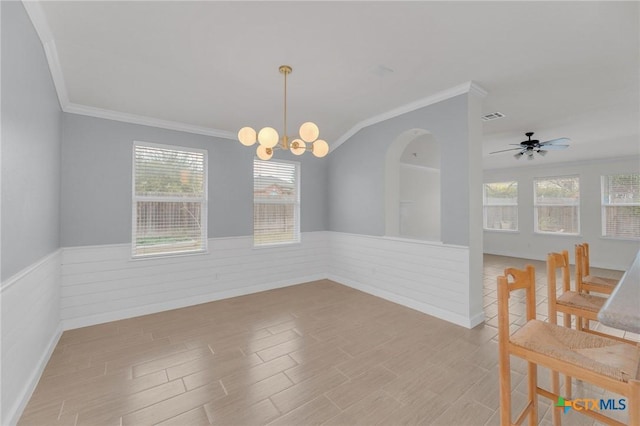 dining room featuring visible vents, wainscoting, and wood finished floors