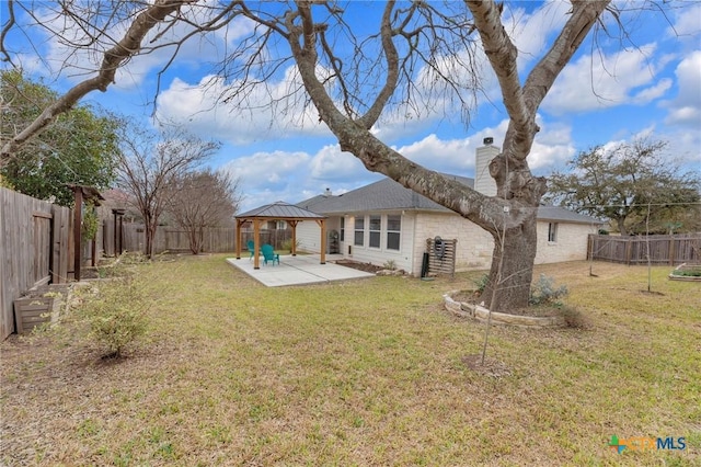 view of yard with a gazebo, a patio area, and a fenced backyard