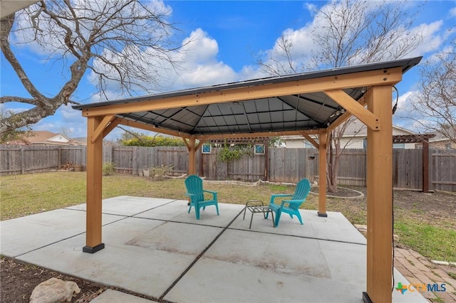 view of patio with a gazebo and a fenced backyard