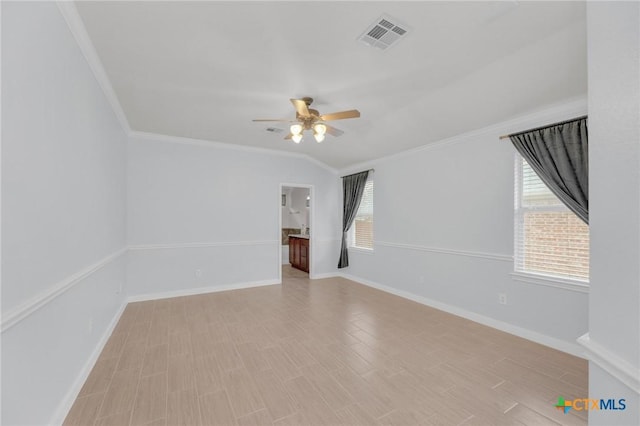 spare room with visible vents, baseboards, light wood-style floors, and ceiling fan