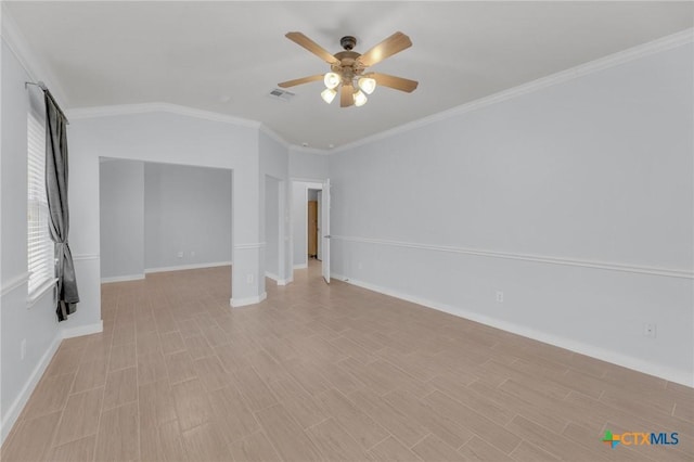 empty room with visible vents, crown molding, light wood-type flooring, and ceiling fan