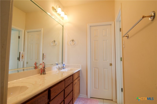 bathroom with vanity and tile patterned floors