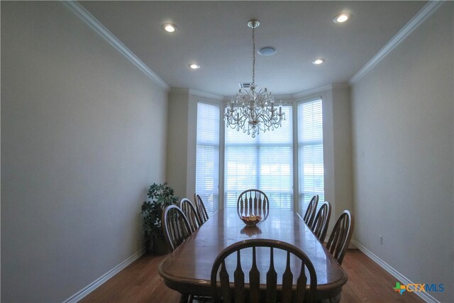 719 Walnut Dr, Killeen, TX 76549 - dining room with crown molding, a chandelier, baseboards, recessed lighting, and wood finished floors