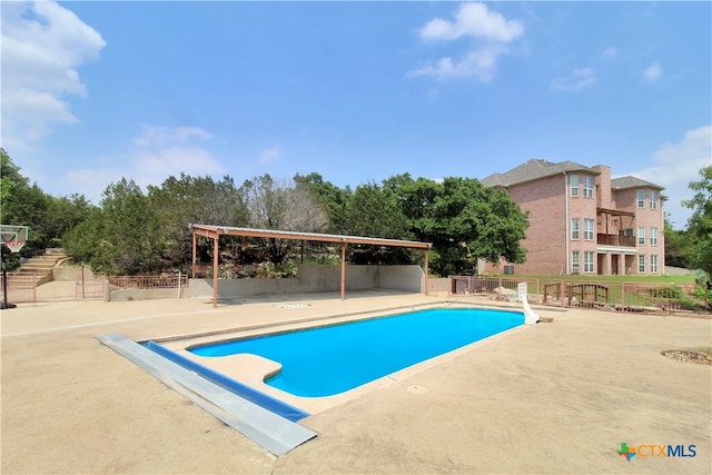 view of pool featuring a patio