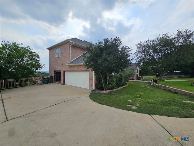 view of property exterior featuring a garage and a yard