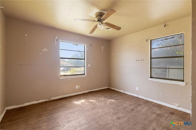 1303 N W S Young Dr, Killeen, TX 76543 - spare room featuring wood finished floors and a ceiling fan