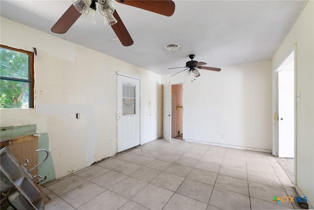 1303 N W S Young Dr, Killeen, TX 76543 - empty room featuring ceiling fan and light tile patterned floors