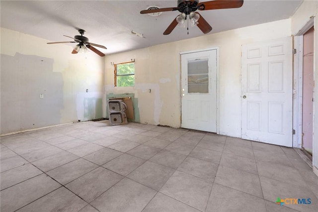 1303 N W S Young Dr, Killeen, TX 76543 - unfurnished living room featuring ceiling fan and tile patterned flooring