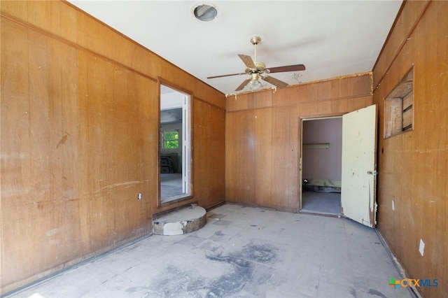 1303 N W S Young Dr, Killeen, TX 76543 - unfurnished bedroom with wooden walls and a ceiling fan