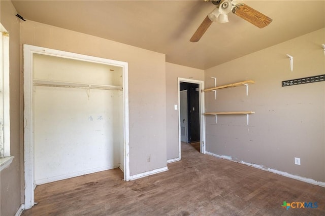 1303 N W S Young Dr, Killeen, TX 76543 - unfurnished bedroom featuring wood finished floors, a closet, and a ceiling fan