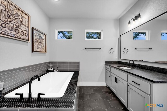 123 Wandering Oak Cir, Burnet, TX 78611 - full bath with tile patterned flooring, vanity, and a bath
