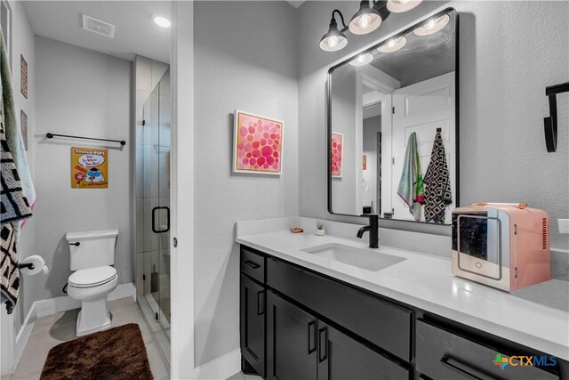 123 Wandering Oak Cir, Burnet, TX 78611 - bathroom featuring a stall shower, toilet, vanity, and baseboards