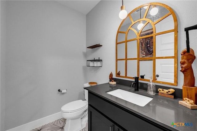 123 Wandering Oak Cir, Burnet, TX 78611 - half bathroom with toilet, vanity, and baseboards
