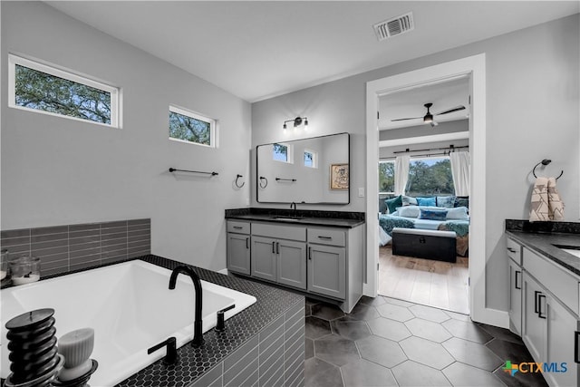 123 Wandering Oak Cir, Burnet, TX 78611 - full bath featuring healthy amount of natural light, ensuite bathroom, and two vanities