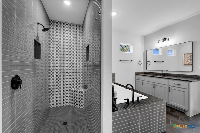 123 Wandering Oak Cir, Burnet, TX 78611 - full bath with a garden tub, a tile shower, vanity, and recessed lighting