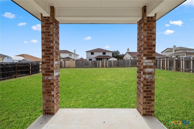 view of yard with a patio and a fenced backyard