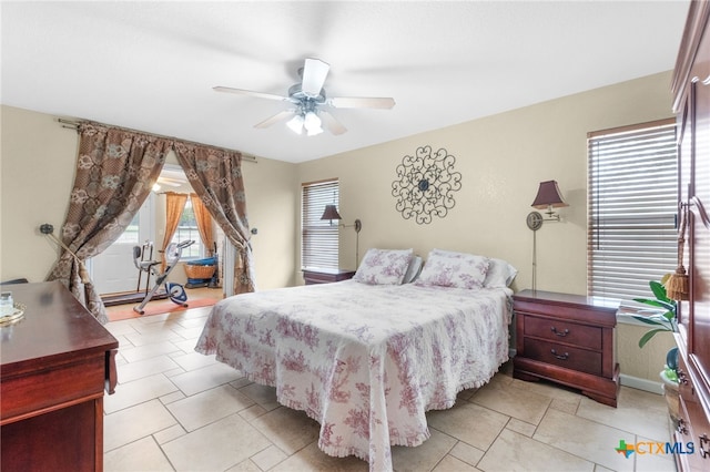 bedroom featuring baseboards and ceiling fan