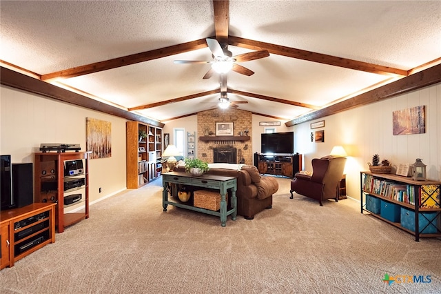 living room with a brick fireplace, light colored carpet, vaulted ceiling with beams, wood walls, and ceiling fan