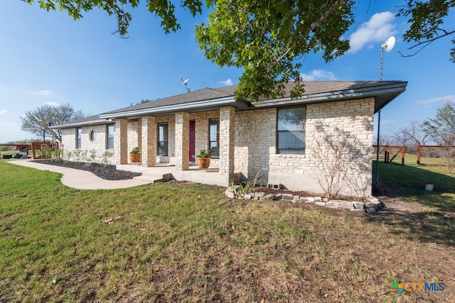 back of house with a yard