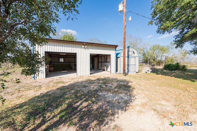 garage featuring a lawn