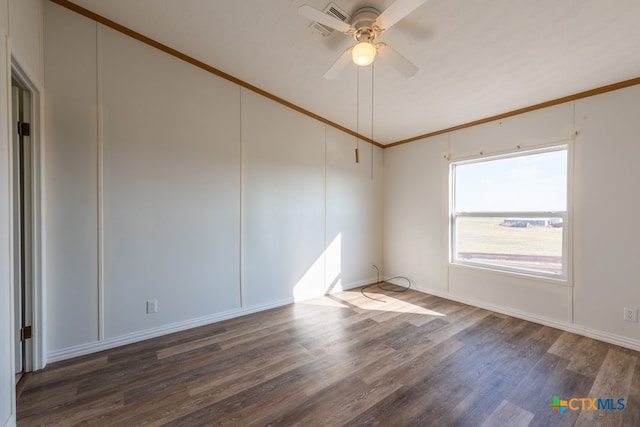 unfurnished room featuring dark hardwood / wood-style floors, ceiling fan, and crown molding