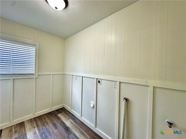 3301 Cypress St, Victoria, TX 77901 - detailed view of wood finished floors, a textured ceiling, and a decorative wall
