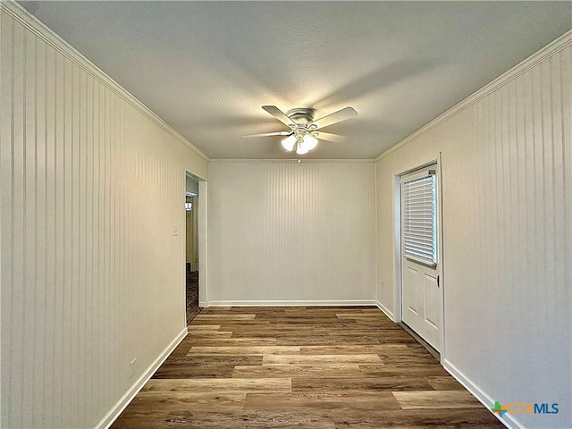 3301 Cypress St, Victoria, TX 77901 - empty room featuring crown molding, wood finished floors, ceiling fan, baseboards, and a textured ceiling