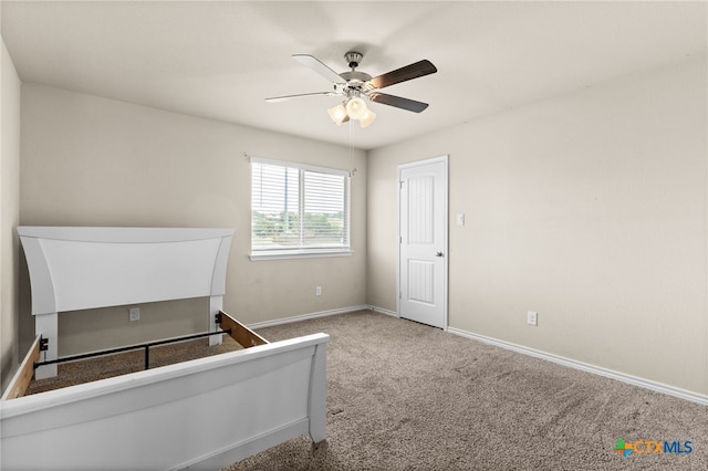 1203 Roma St, Harker Heights, TX 76548 - unfurnished bedroom featuring baseboards, carpet floors, and a ceiling fan