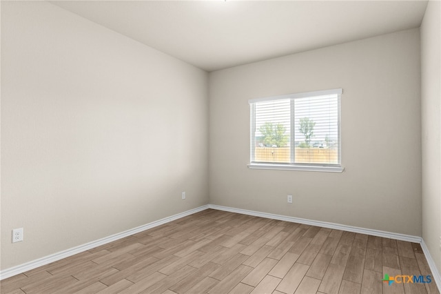 1203 Roma St, Harker Heights, TX 76548 - spare room featuring light wood-style flooring and baseboards