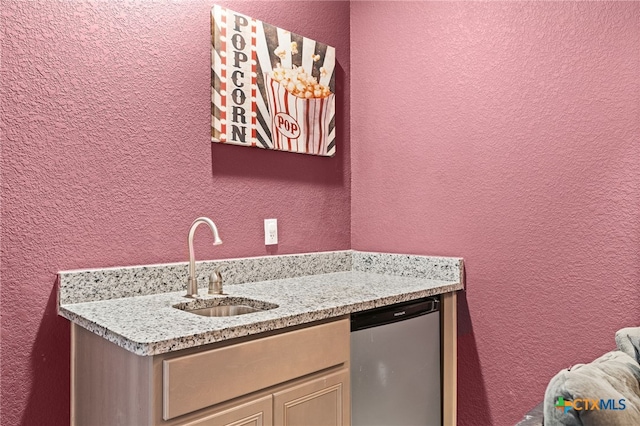 1203 Roma St, Harker Heights, TX 76548 - indoor wet bar with a textured wall and stainless steel dishwasher