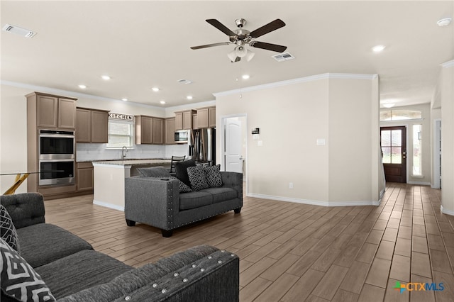 1203 Roma St, Harker Heights, TX 76548 - living area featuring ornamental molding, a ceiling fan, light wood finished floors, baseboards, and recessed lighting
