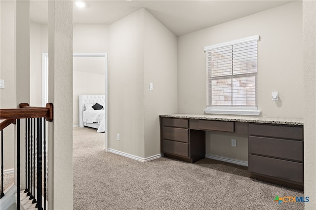 1203 Roma St, Harker Heights, TX 76548 - unfurnished office with light carpet, built in study area, and baseboards