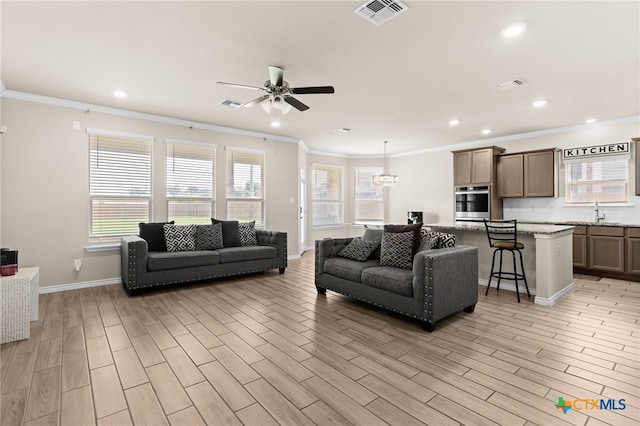 1203 Roma St, Harker Heights, TX 76548 - living area with recessed lighting, ceiling fan, ornamental molding, light wood finished floors, and baseboards