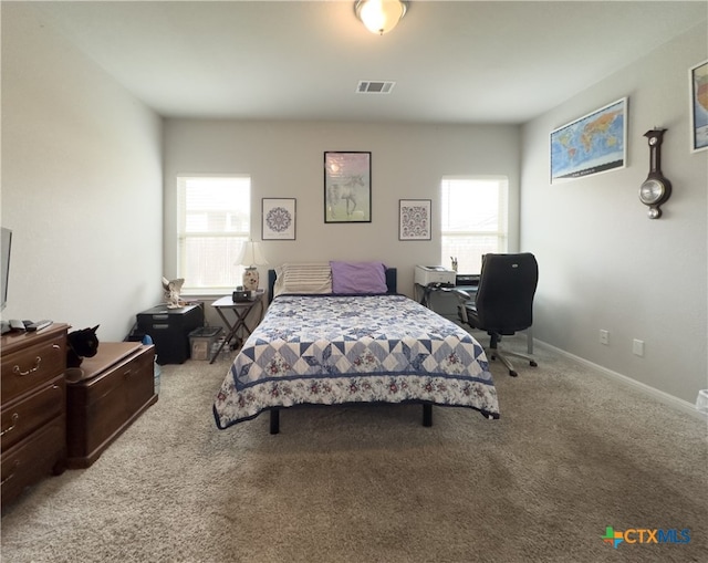 bedroom with light colored carpet