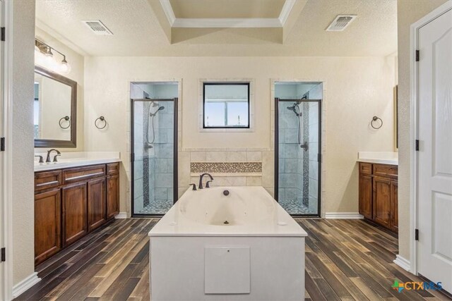 5907 Verde Dr, Killeen, TX 76549 - full bathroom with wood finished floors, a shower stall, vanity, a tub with jets, and crown molding