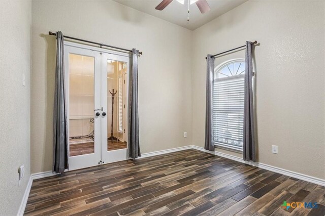 5907 Verde Dr, Killeen, TX 76549 - spare room featuring french doors, dark wood finished floors, ceiling fan, and baseboards