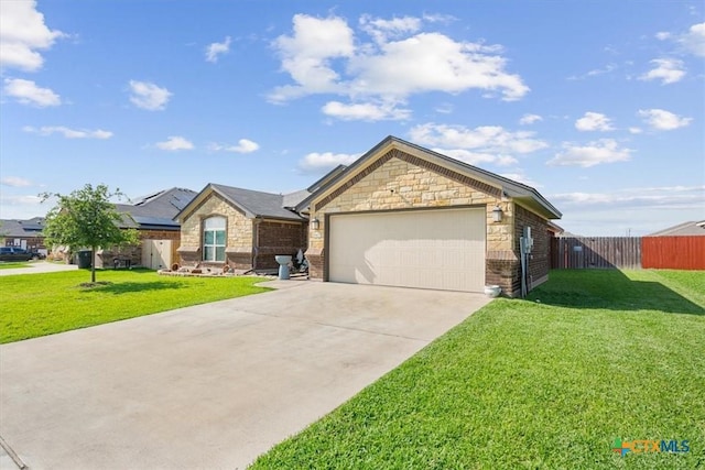5907 Verde Dr, Killeen, TX 76549 - view of front facade featuring concrete driveway, a garage, stone siding, and brick siding