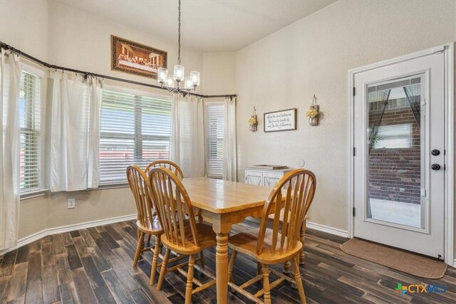 5907 Verde Dr, Killeen, TX 76549 - dining room featuring dark wood finished floors, a chandelier, and baseboards