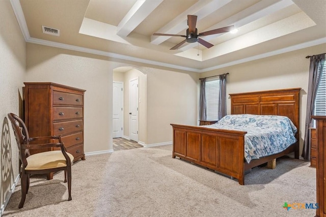 5907 Verde Dr, Killeen, TX 76549 - bedroom featuring a raised ceiling, arched walkways, light carpet, ornamental molding, and baseboards