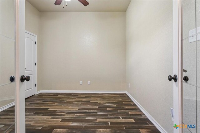 5907 Verde Dr, Killeen, TX 76549 - empty room featuring a ceiling fan, dark wood finished floors, and baseboards