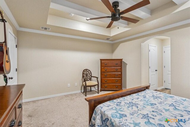 5907 Verde Dr, Killeen, TX 76549 - bedroom with a raised ceiling, arched walkways, light colored carpet, baseboards, and crown molding