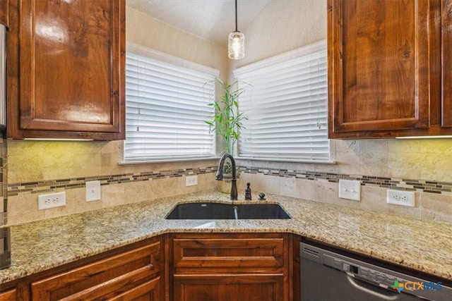 5907 Verde Dr, Killeen, TX 76549 - kitchen with stainless steel dishwasher, a sink, decorative backsplash, and light stone counters